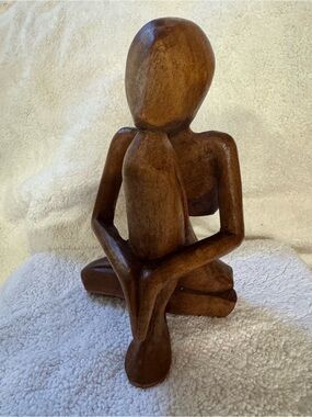 Contemplative Brown Handcrafted Wooden Sculpture